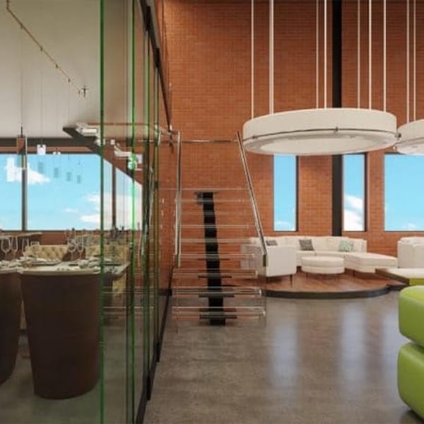 Modern restaurant interior with glass partitions, brick walls, white lounge seating, and a glass staircase.