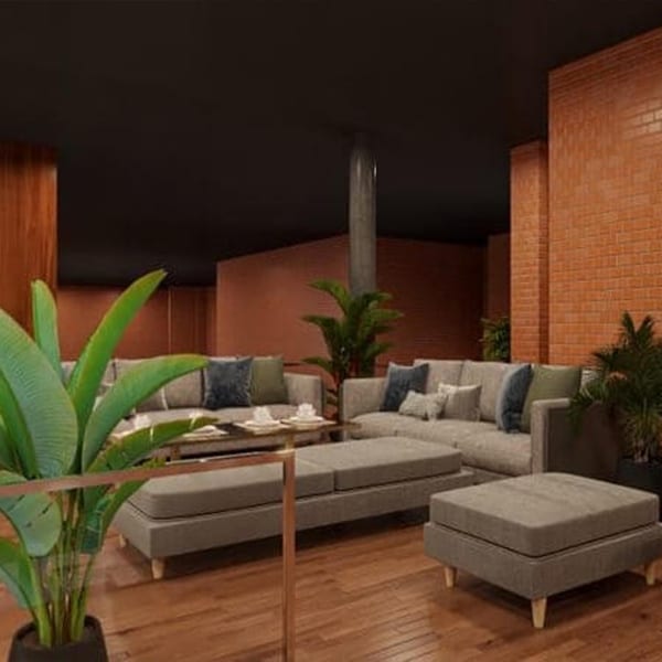 Aroma Restaurant & Lounge's modern lounge area with gray sofas, wooden floors, and brick walls.